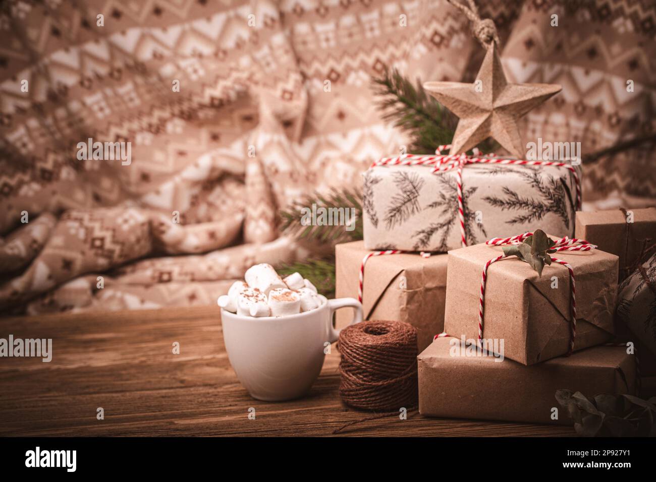 Selective closeup shot of decorated gift boxes wrapped with beige wrapping  paper Stock Photo by wirestock