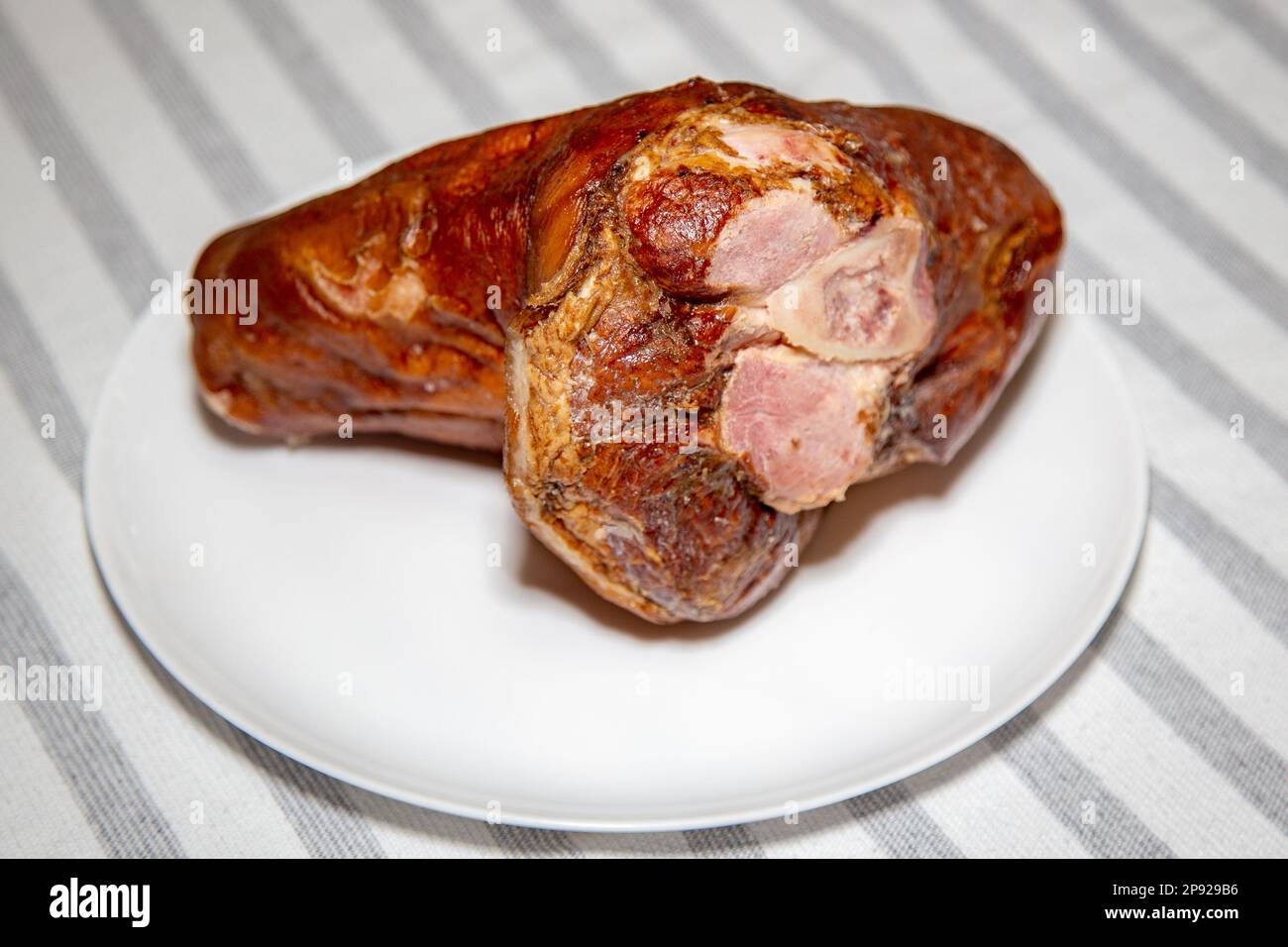 Smoked pork knuckle, traditional German dish, isolated portrait and