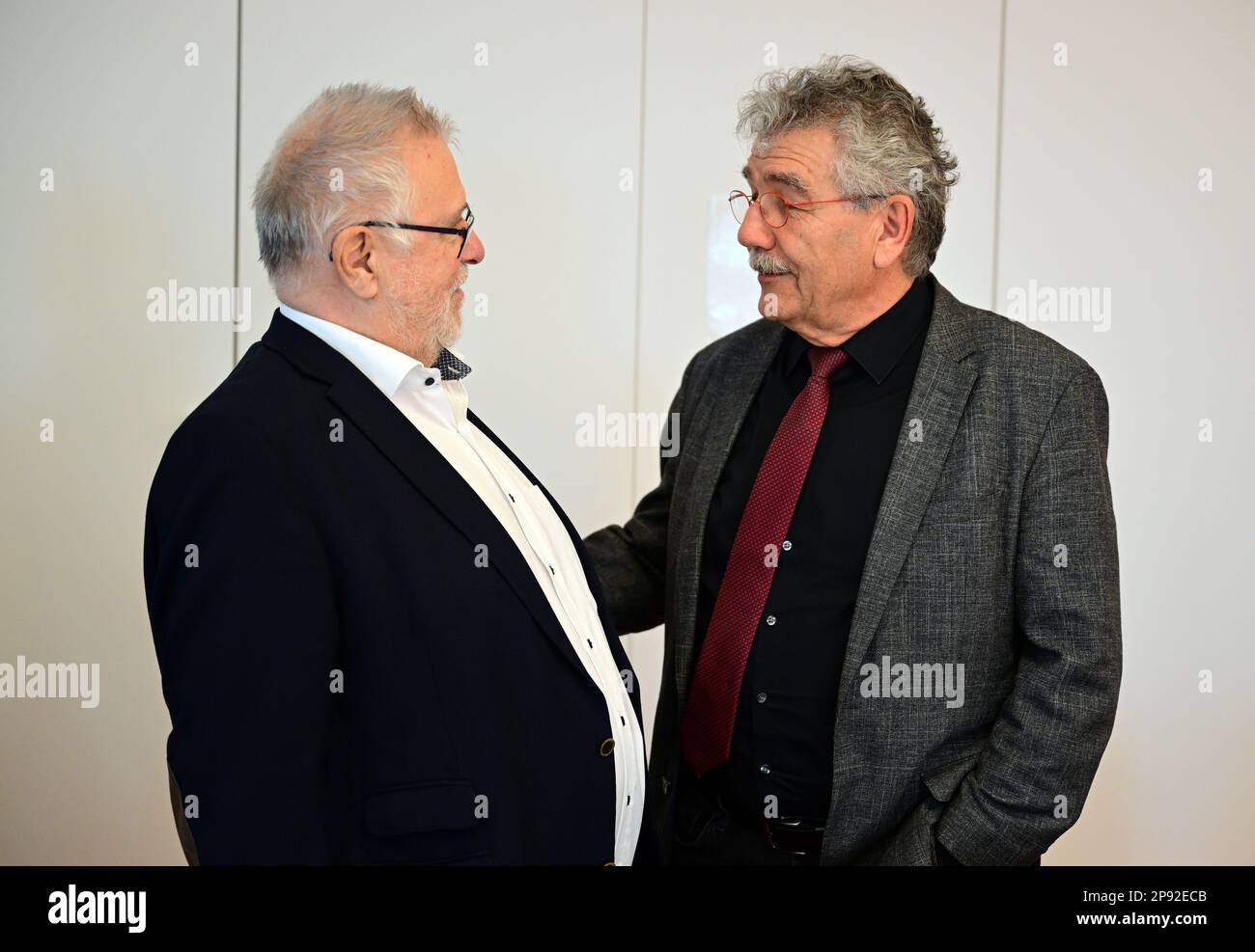 Potsdam, Germany. 10th Mar, 2023. Rainer Bretschneider (l), retired State Secretary, former airport coordinator and former Chairman of the Supervisory Board of Flughafen Berlin Brandenburg GmbH, and Helmut Barthel (SPD), Deputy Chairman of Investigation Committee 7/2, greet each other before the start of questioning in the Investigation Committee of the Brandenburg State Parliament. The committee wants to clarify the issue of cost and schedule overruns in the construction of Berlin-Brandenburg Airport. Credit: Soeren Stache/dpa/Alamy Live News Stock Photo