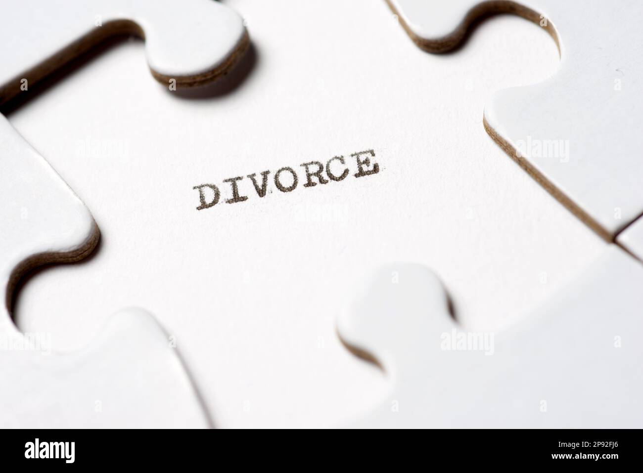 Divorce intelligence text written with a typewriter in a white puzzle Stock Photo