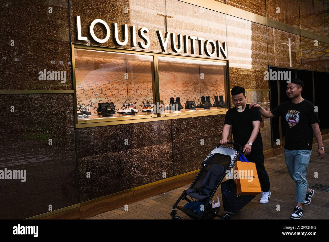 Hong Kong China. 10th Mar 2023. Shoppers walk pass a luxury