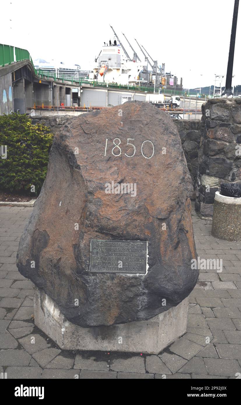 A memorial stone, Pilgrims Rock, at the New Zealand port of Lyttelton said to commemorate the spot where the First Canterbury Settlers came ashore. Stock Photo