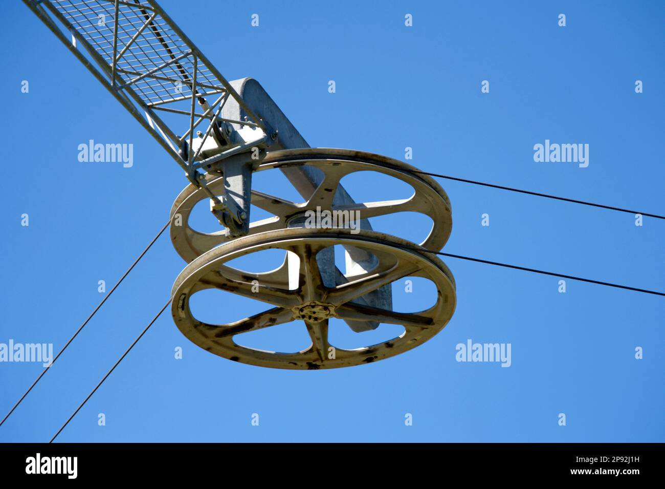 Photo of a big pulley tensioner for an aerial cable Stock Photo Alamy