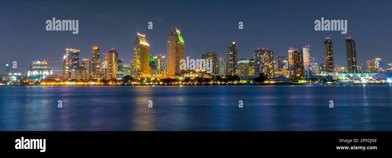 Panorama of San Diego skyline at night with water colorful reflections, view from Coronado island, California Stock Photo