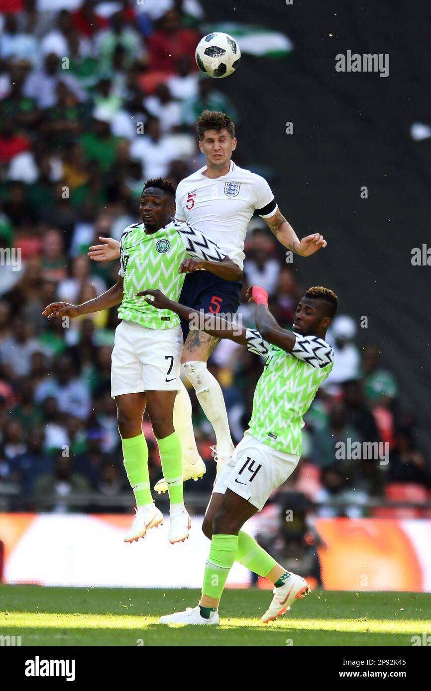 John Stones of England looks to win a header in the air against Ahmed Musa of Nigeria - England v Nigeria, International Friendly, Wembley Stadium, London - 2nd June 2018. Stock Photo