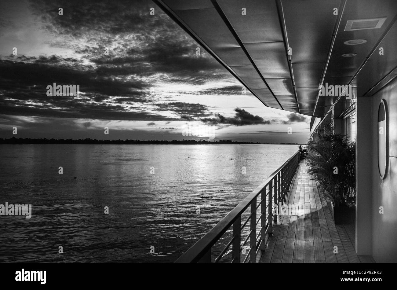 The port side of the Victoria Mekong river cruise ship at dawn near Phnom Penh on the Mekong River in Cambodia. Stock Photo