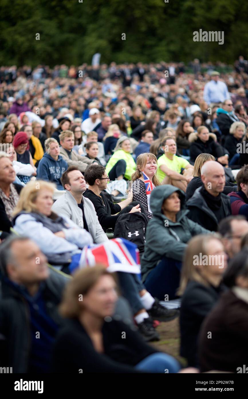 People watch the TV coverage of the late Queen Elizabeth II’s funeral