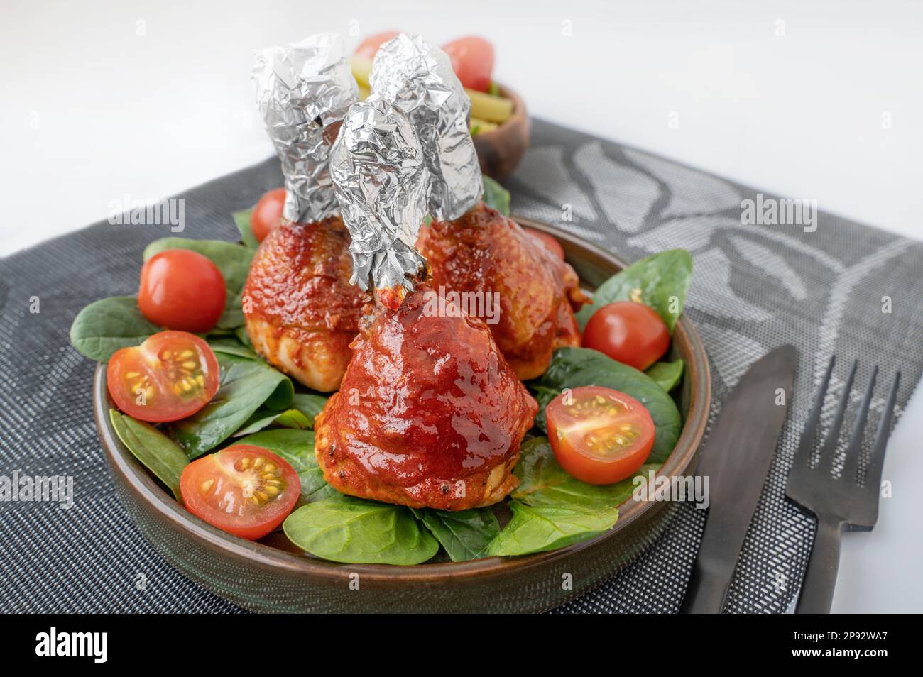 Chicken drumsticks in smoked paprika sauce baked under the grill