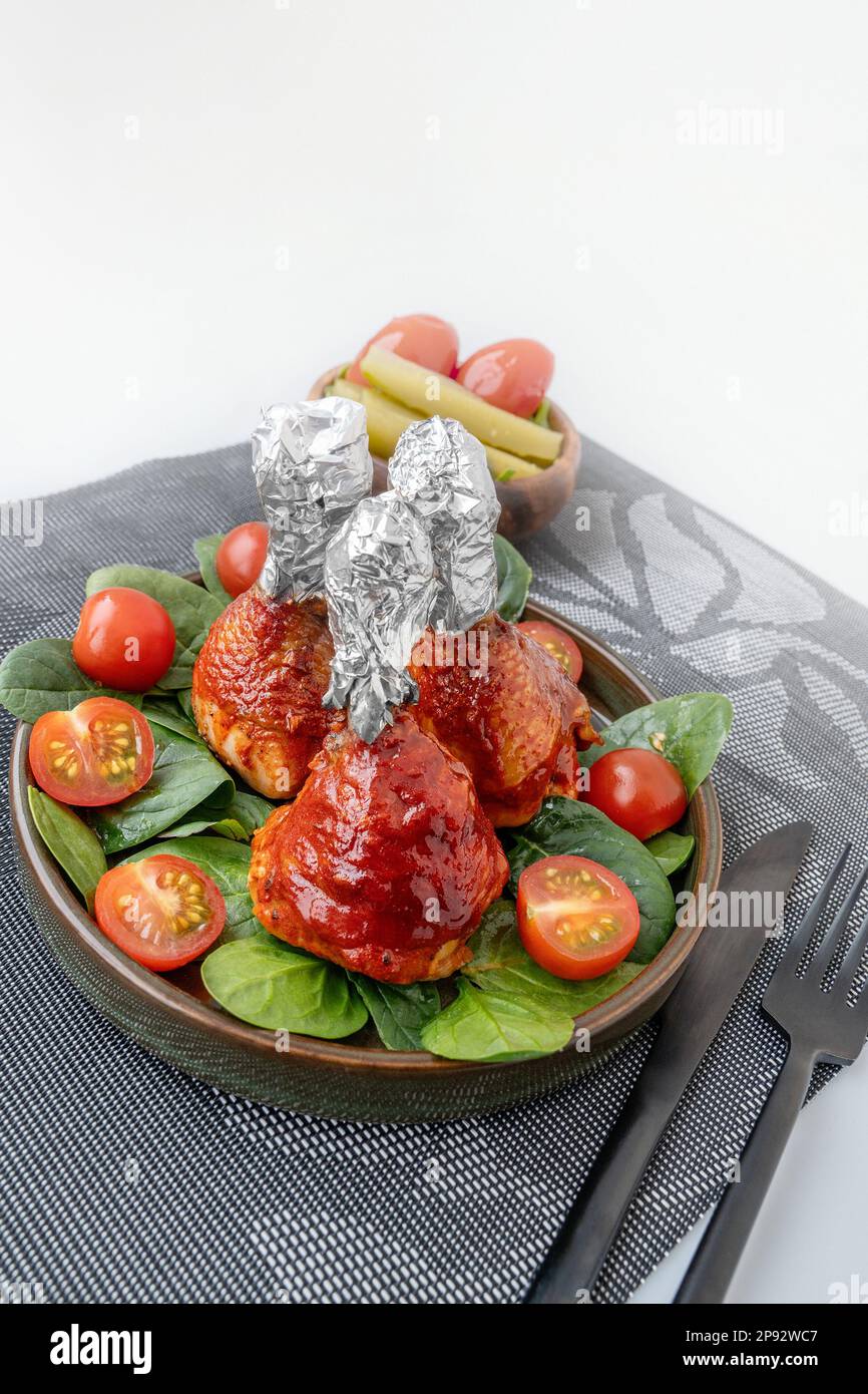 Chicken drumsticks in smoked paprika sauce baked under the grill