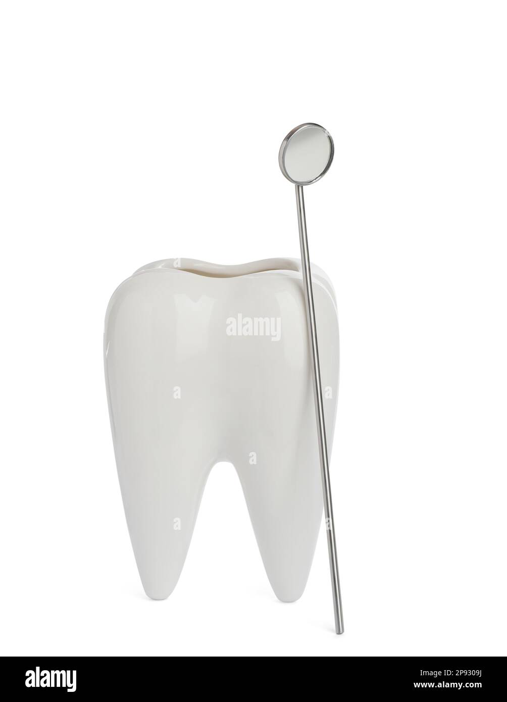 Tooth shaped holder and mouth mirror on white background Stock Photo ...