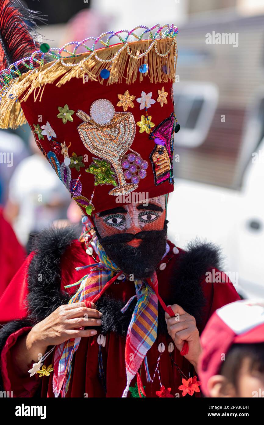 A chinelo with his sombrero looking at the camera while dancing in a  carnival in Mexico Stock Photo - Alamy