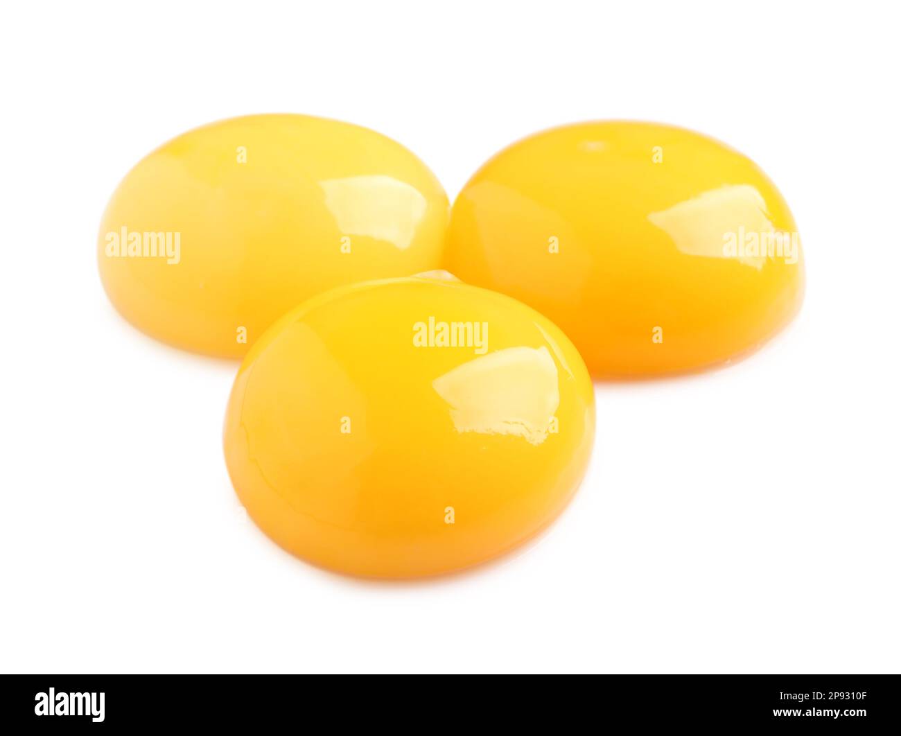 Raw chicken egg yolks on white background Stock Photo Alamy