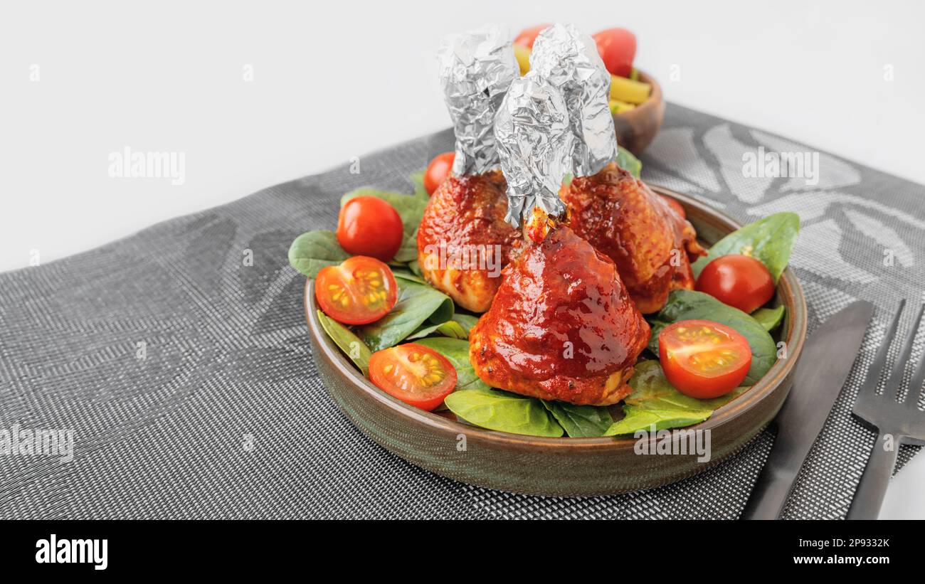 Chicken drumsticks in smoked paprika sauce baked under the grill