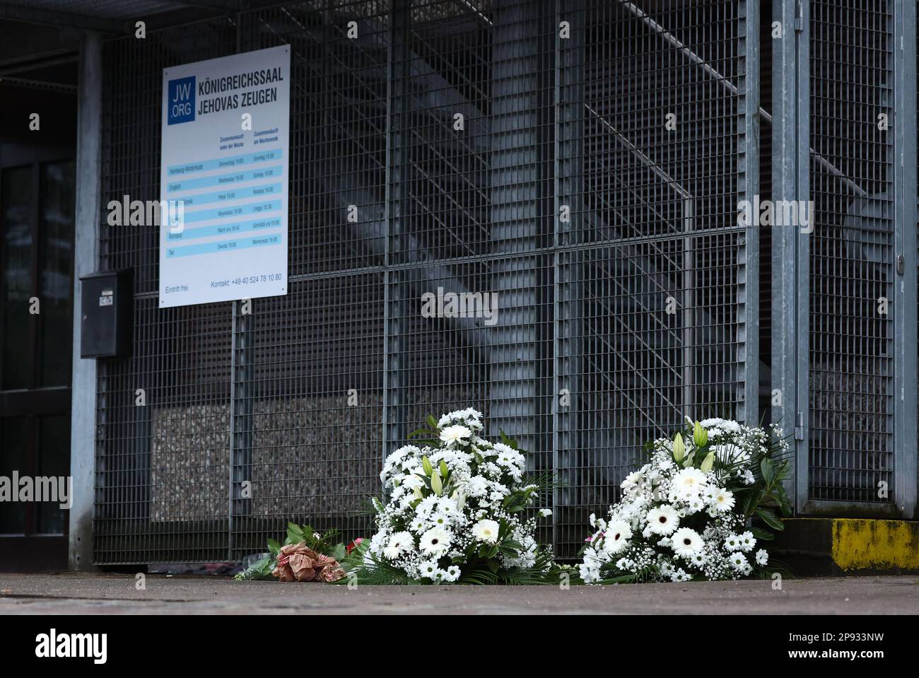 Hamburg, Germany. 10th Mar, 2023. Flowers lie in front of the Jehovah's Witnesses building in the Alsterdorf district. Several people were killed and some injured in a rampage during a Jehovah's Witness event on Thursday evening. Credit: Christian Charisius/dpa/Alamy Live News Stock Photo