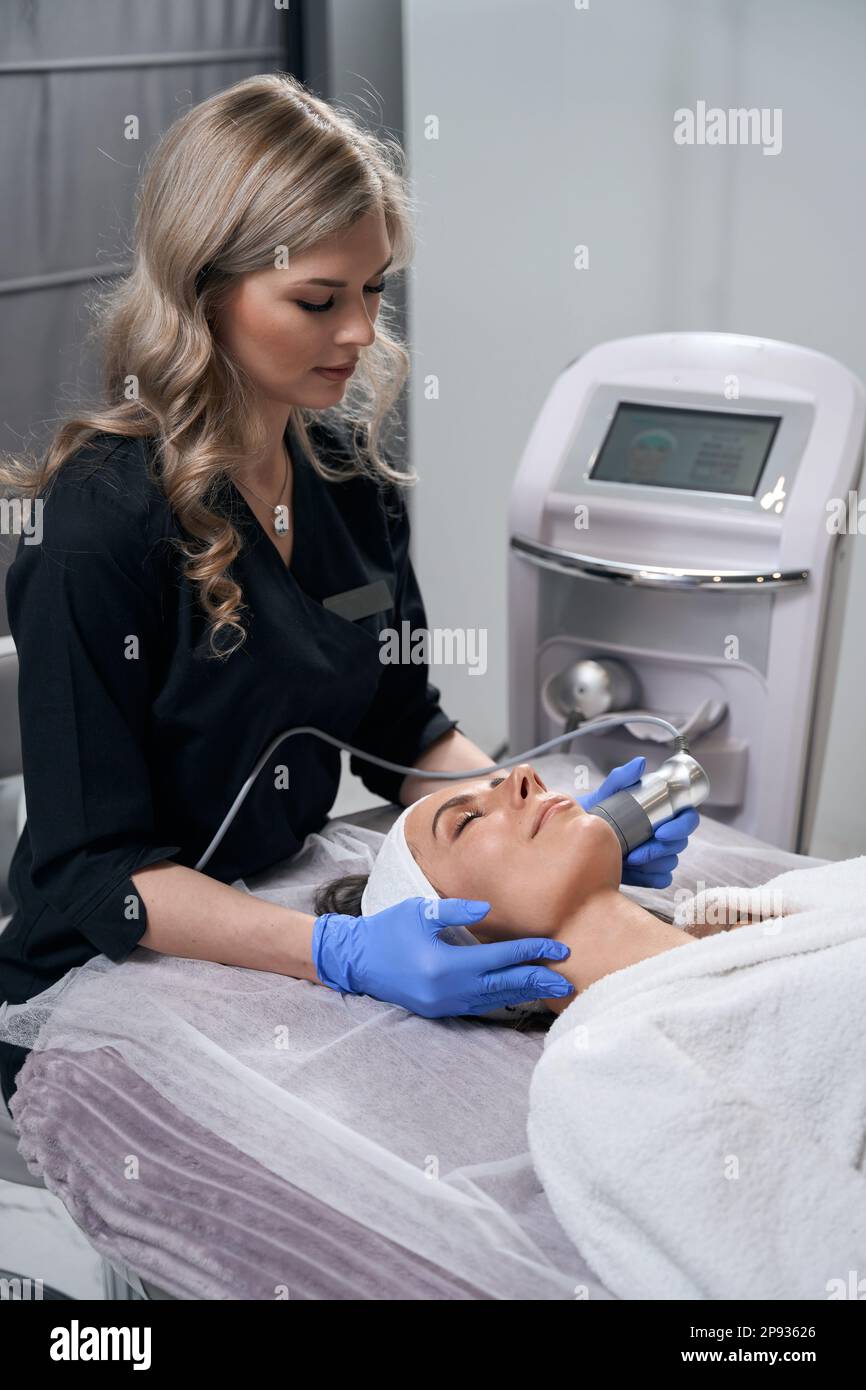 Woman undergoes cosmetic procedures hi-res stock photography and images ...