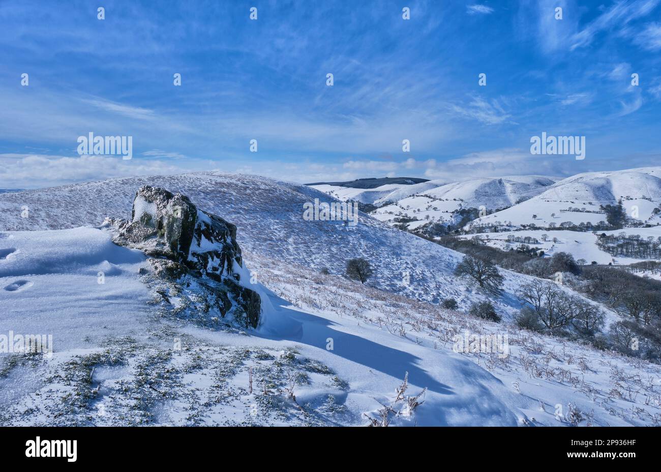 Ice-crusted rock on Ragleth Hill, Church Stretton, Shropshire Stock Photo