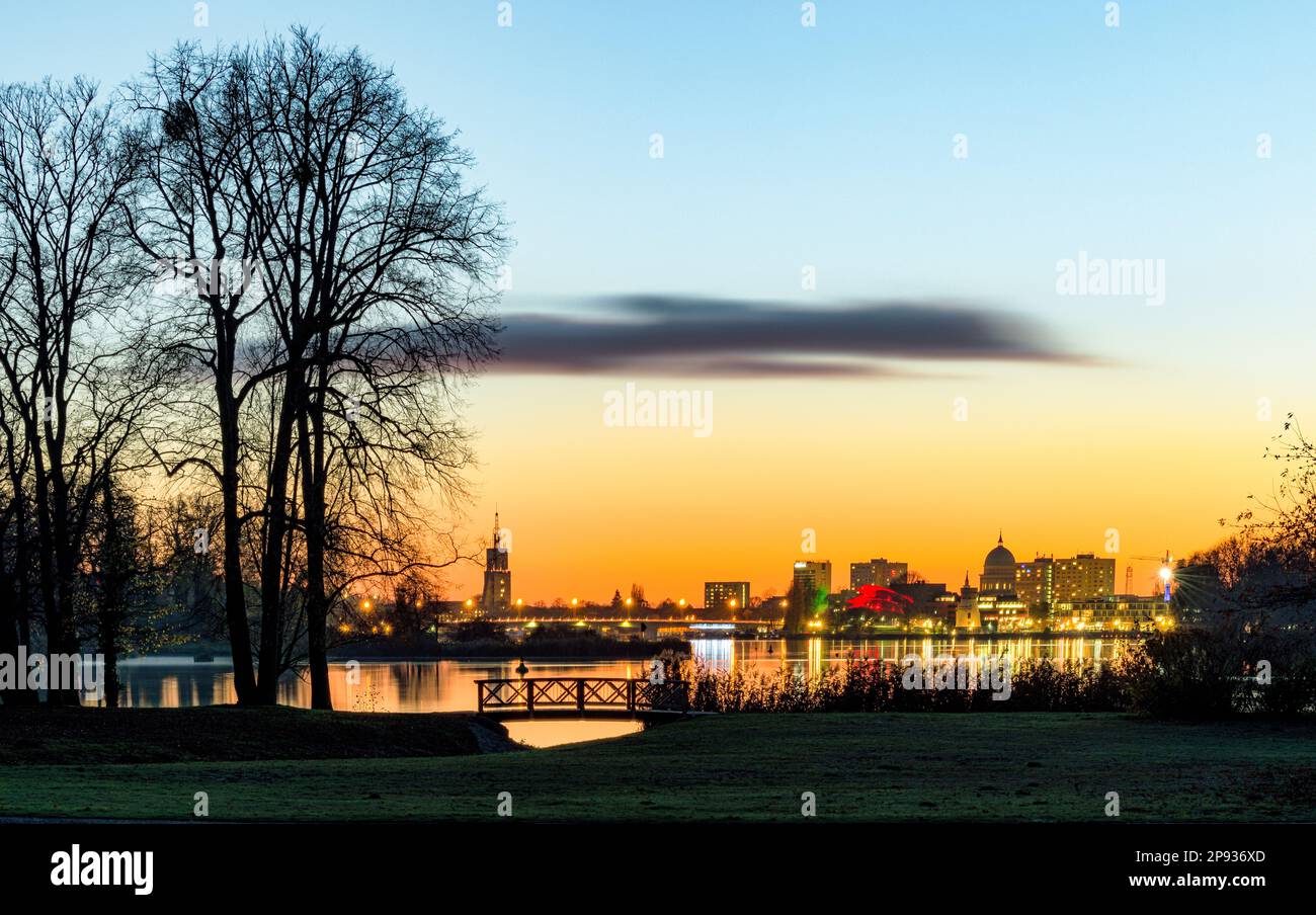 View over Tiefen See at dusk in Potsdam with silhouette of Potsdam in background Stock Photo