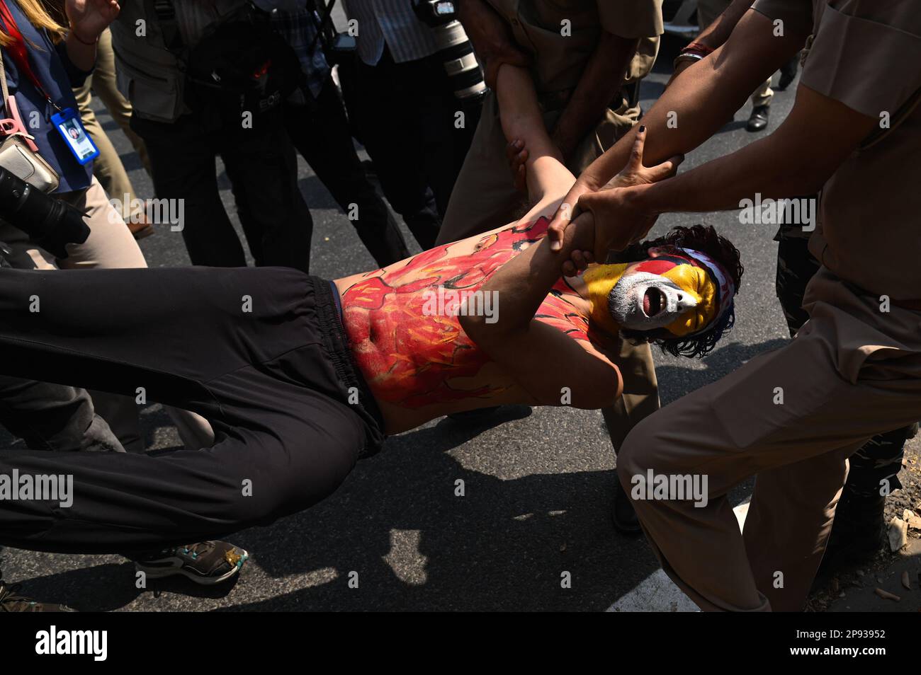 New Delhi, Delhi, India. 10th Mar, 2023. Police officers detain a youth activist of the Tibetan Youth Congress during a protest held to mark the anniversary of the 64th Tibetan National Uprising Day outside the Chinese Embassy in New Delhi. (Credit Image: © Kabir Jhangiani/ZUMA Press Wire) EDITORIAL USAGE ONLY! Not for Commercial USAGE! Stock Photo