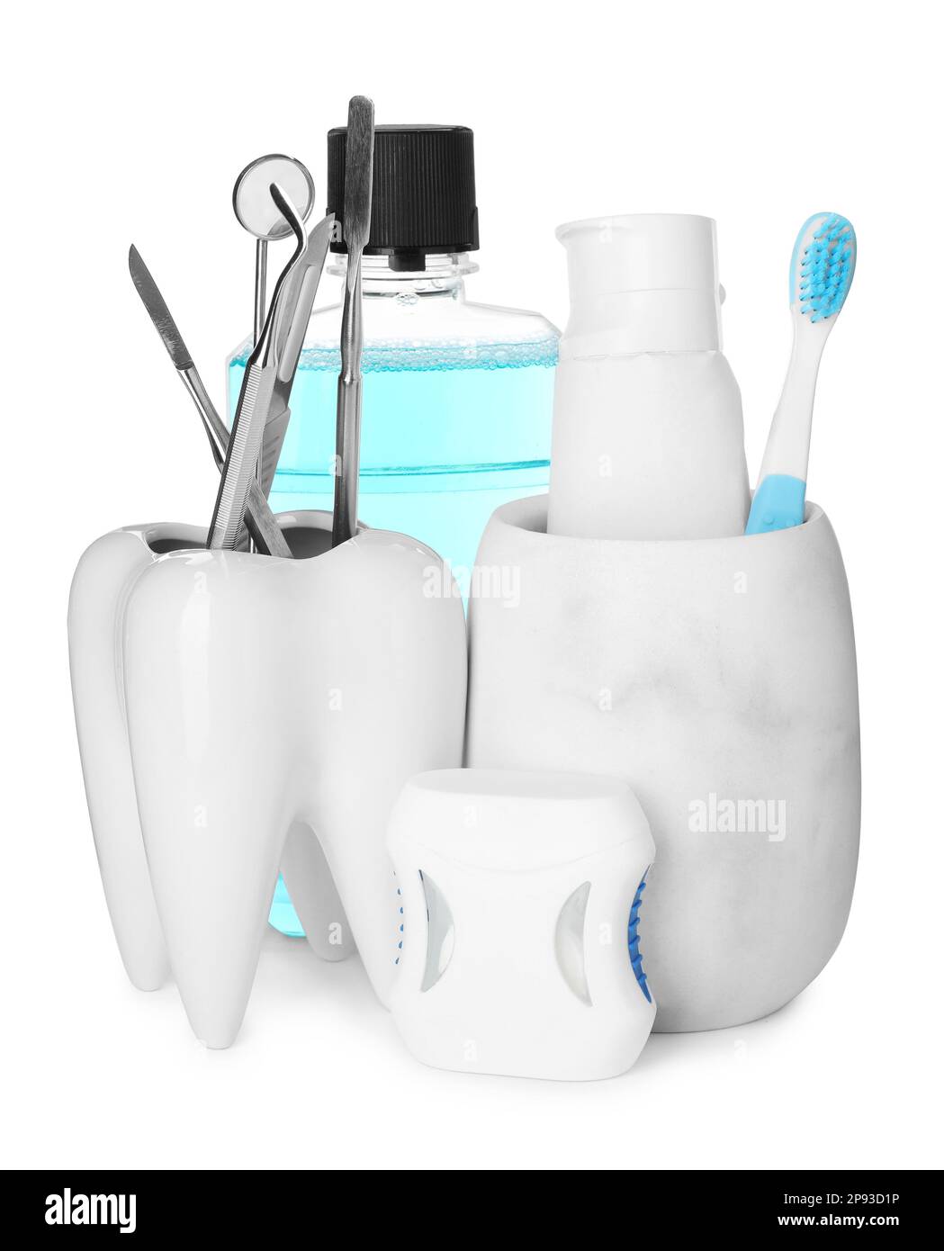 Many different teeth care products and dental tools on white background