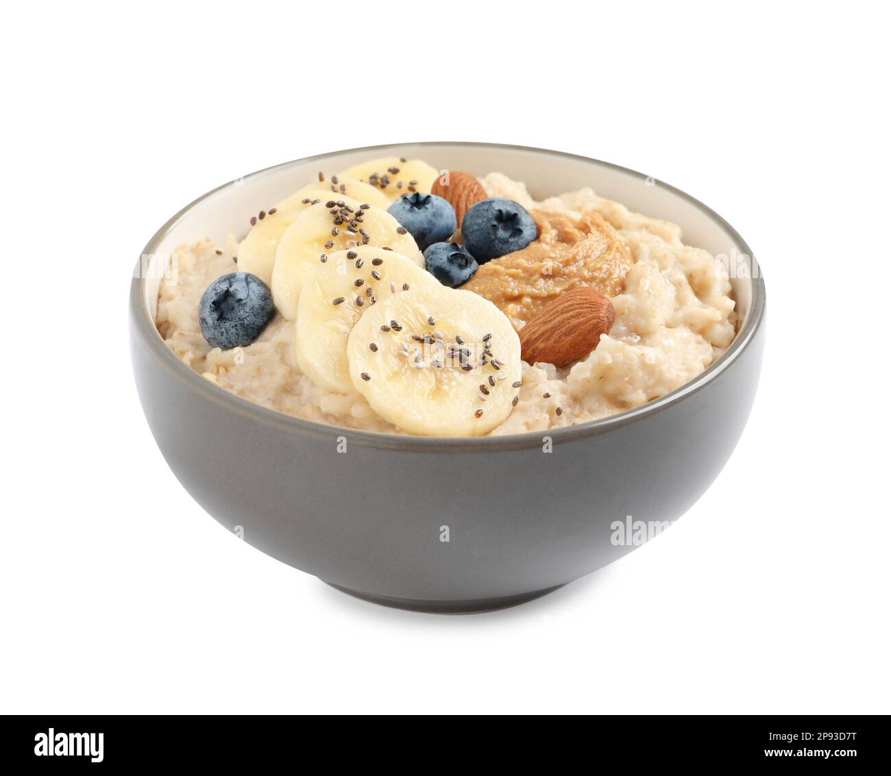 Tasty oatmeal porridge with different toppings in bowl on white