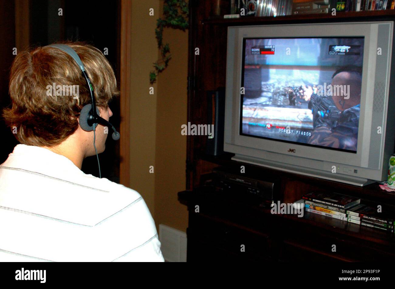 Devin Krauter, 17, plays the game "Gears of War 2" on the XBox 360 at his  home in Fargo, N.D., Wednesday, Dec. 15, 2008. Microsoft has put up $1.5  million to start