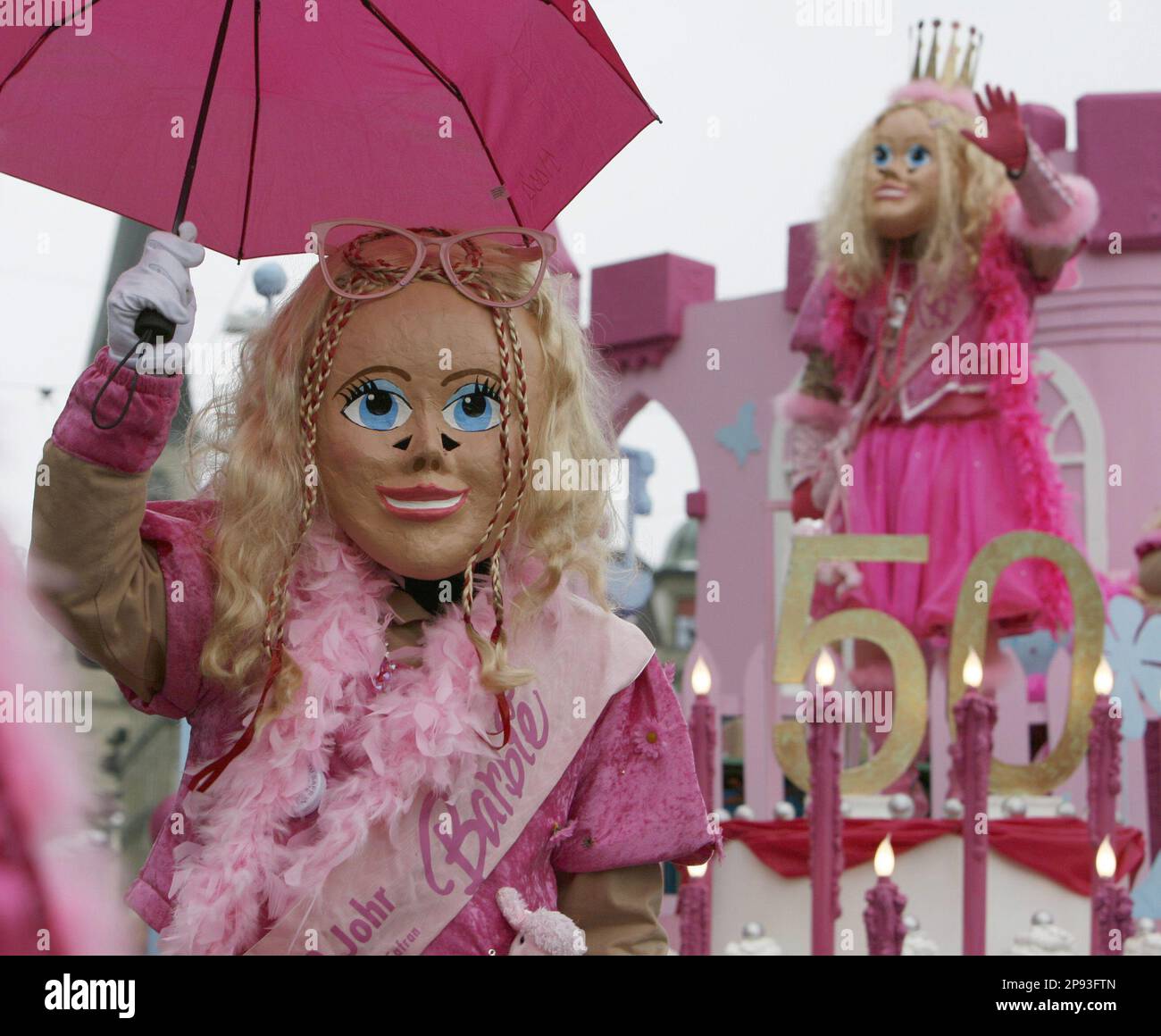 Revelers in a fanciful Barbie costumes participate in the carnival  procession in downtown Lucerne, Switzerland, Monday, Feb. 23, 2009. (AP  Photo/KEYSTONE/Urs Flueeler Stock Photo - Alamy