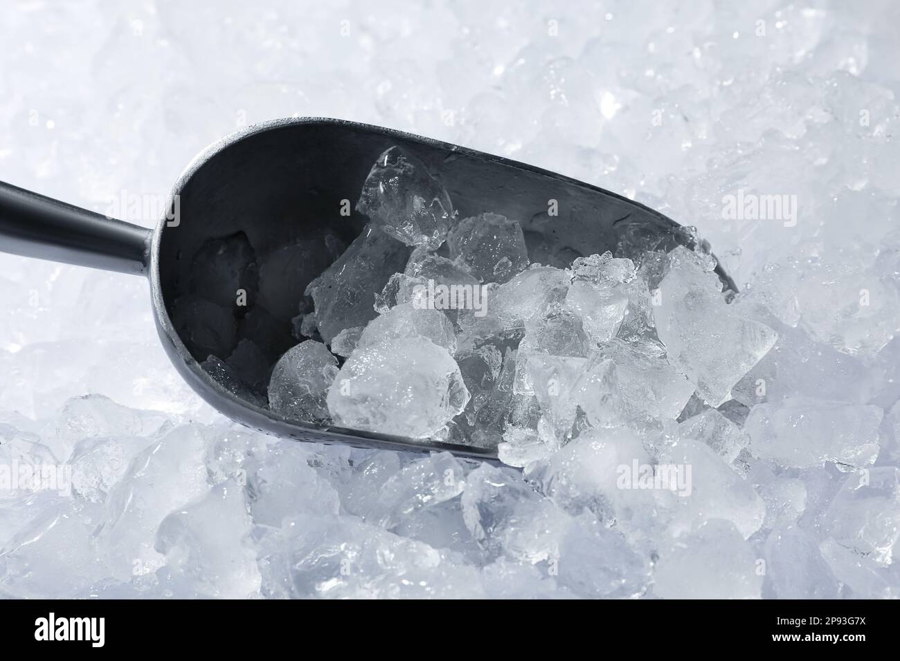 Metal scoop on crushed ice, closeup view Stock Photo Alamy