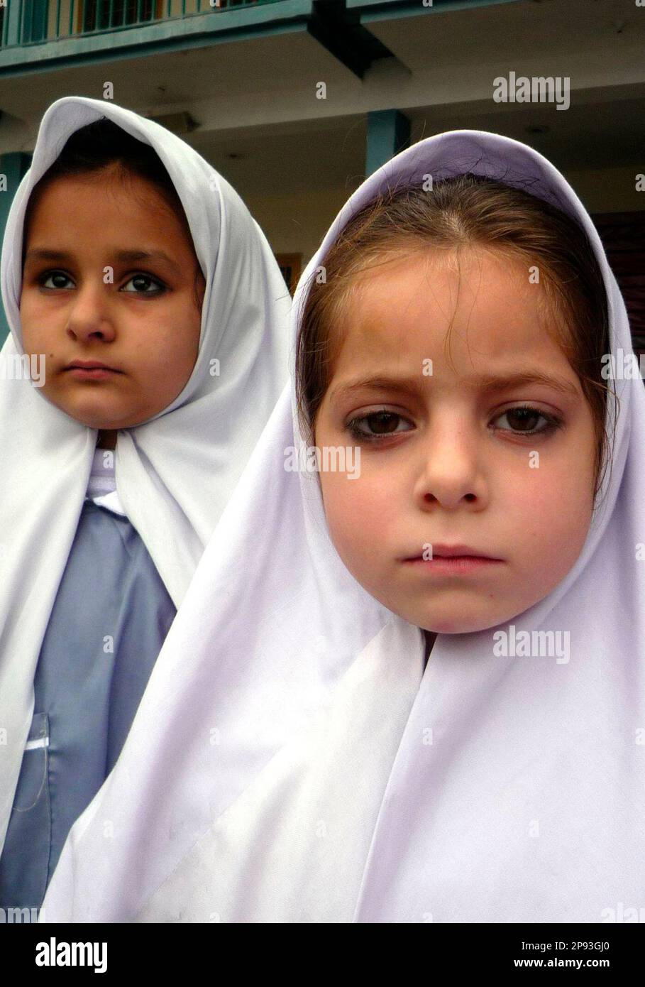 pakistani-girls-wait-to-enter-their-classroom-in-a-private-school-in