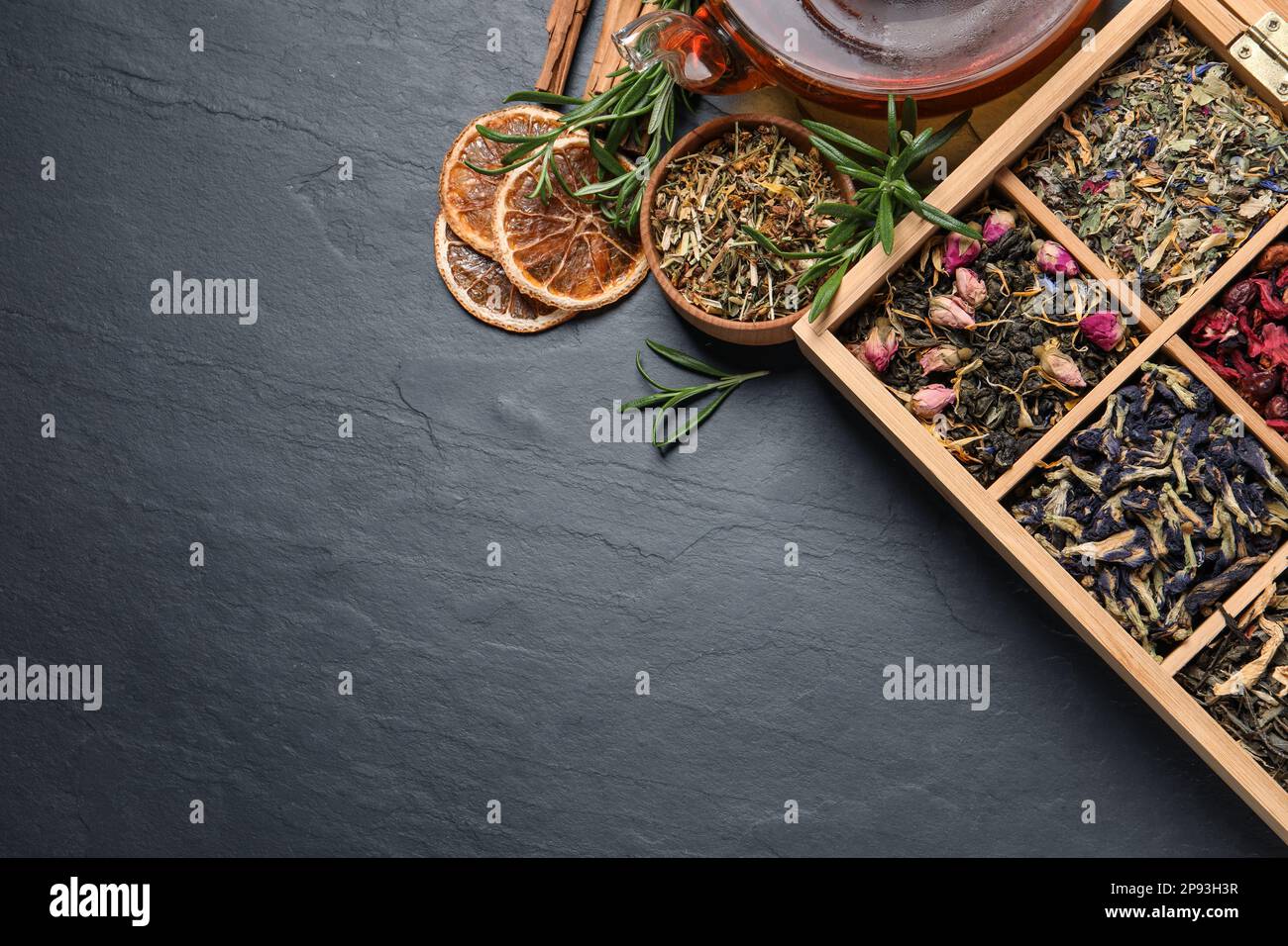 Dry Tea Flat lay composition with different dry teas and hot drink on black ...