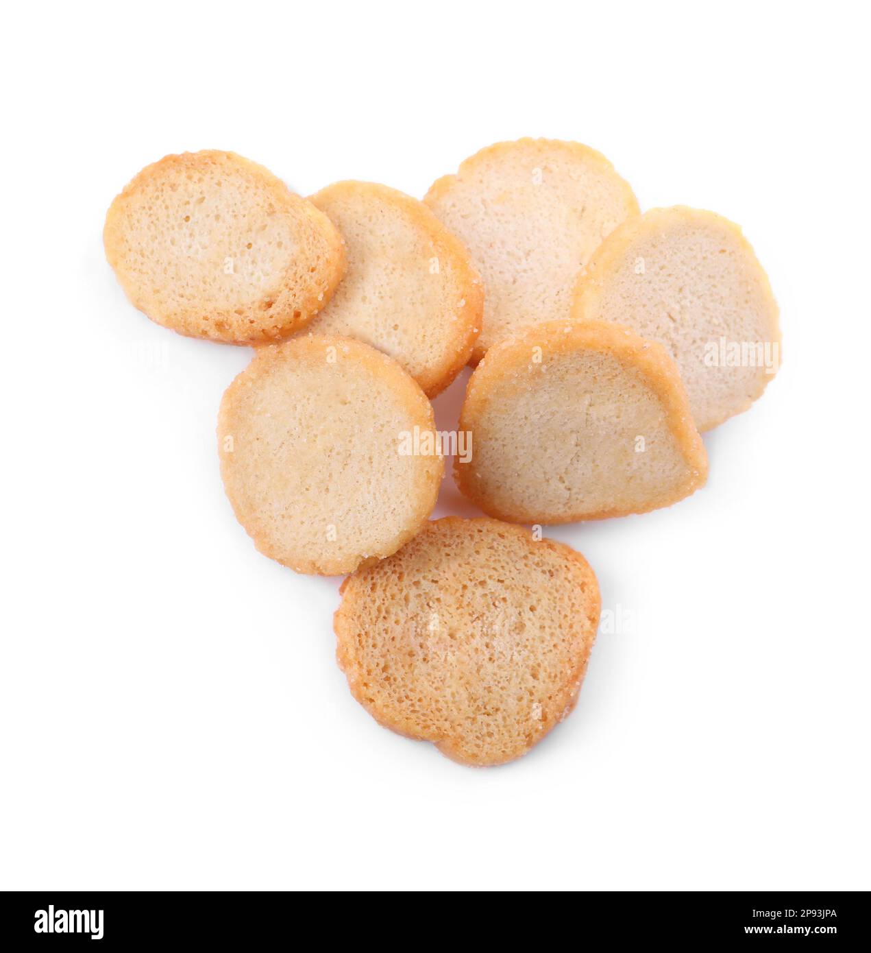 Pile of delicious crispy rusks on white background, top view Stock ...