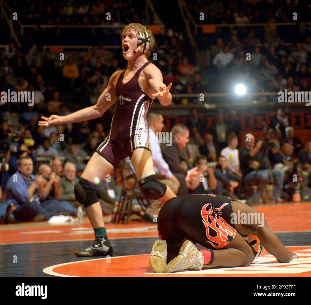 Dakota's Seth Milks, left, reacts to his win as Kewanee's Jermaine