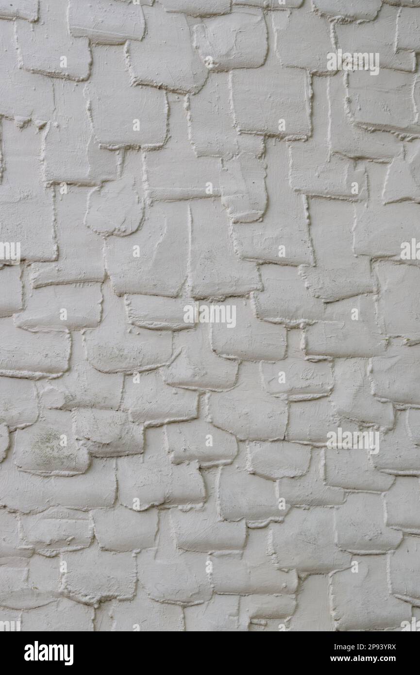 Concrete render creating a pattern on the wall of an old clay lump ...