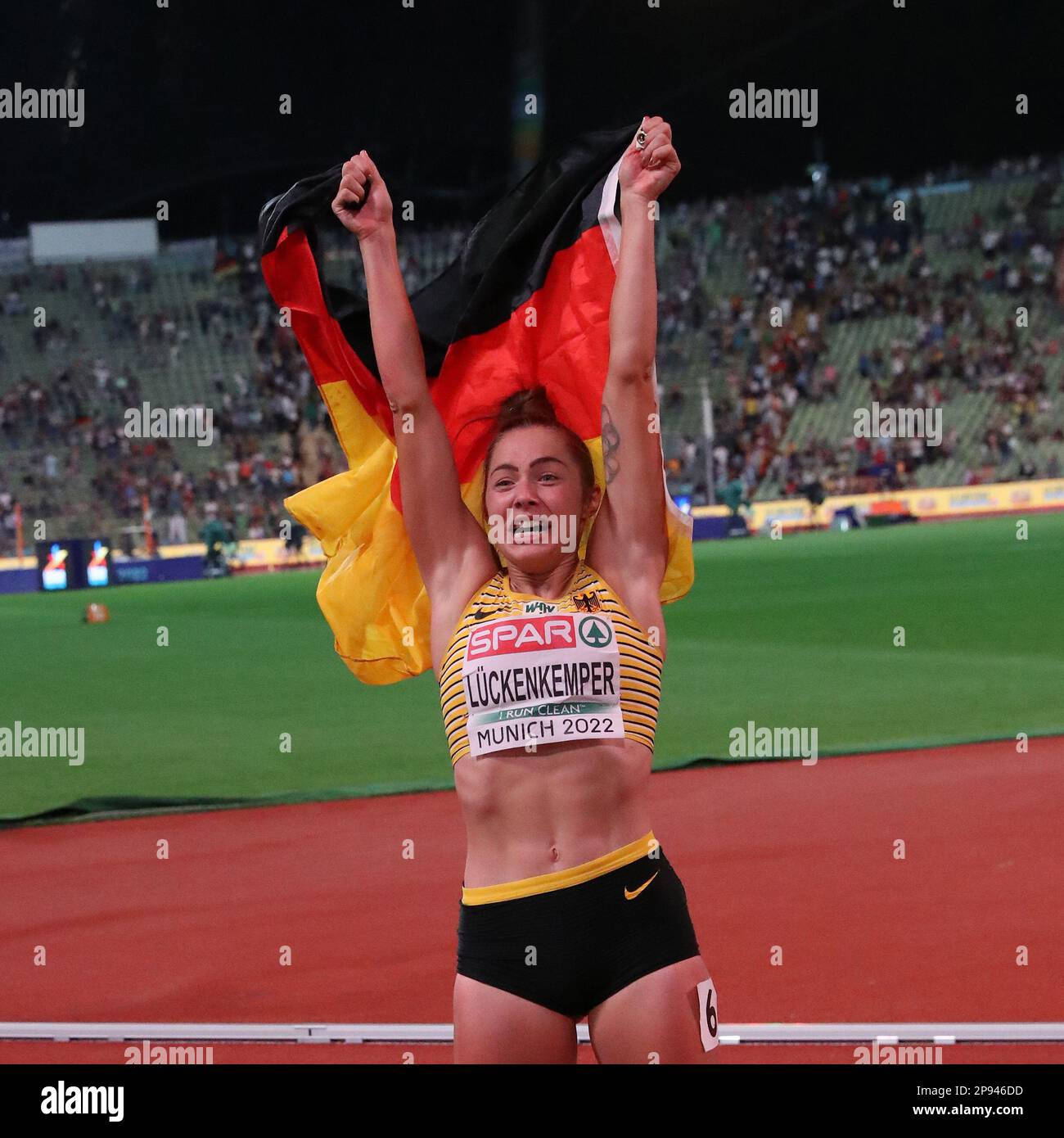 Gina LÜCKENKEMPER with the Germany Flag after winning the 100m Final at