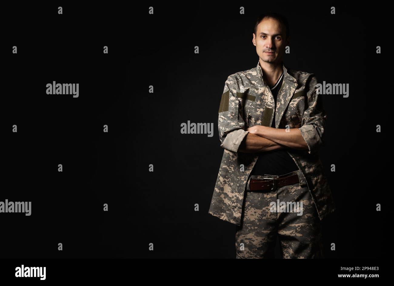 Serious Army Soldier on black background. Stock Photo