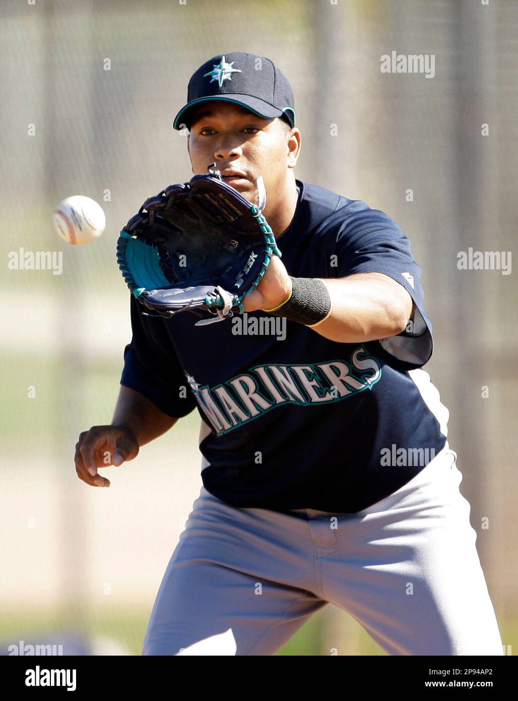 Seattle Mariners infielder Jose Lopez catches a ball during