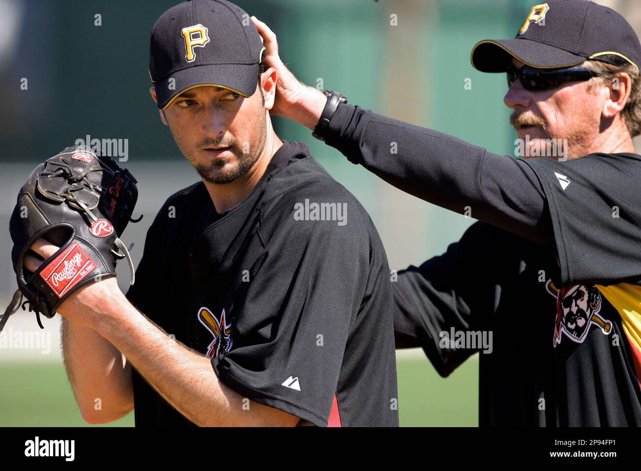 Pittsburgh Pirates pitching coach Joe Kerrigan, right, gives some tips