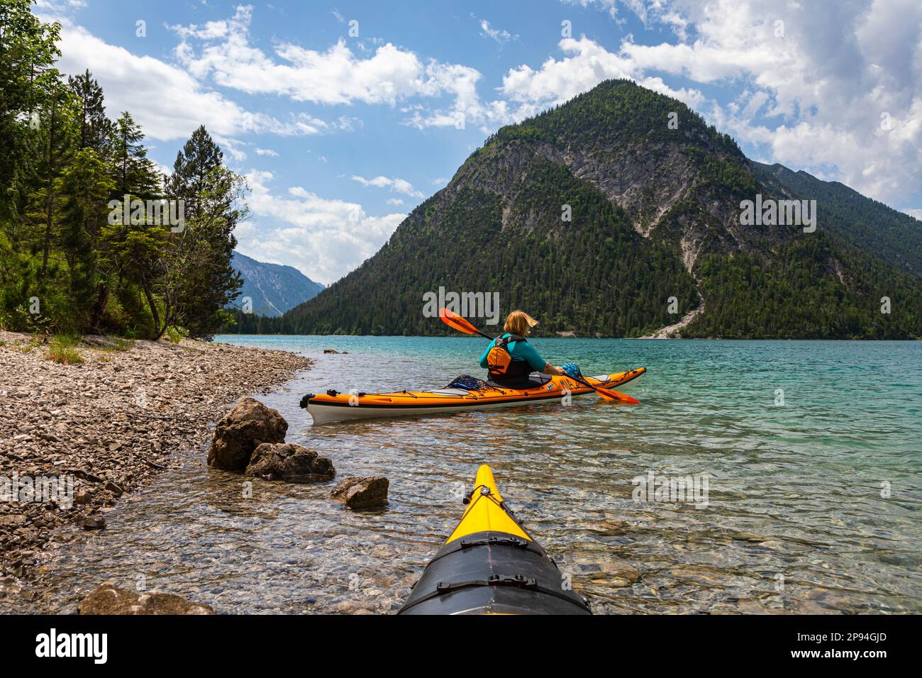 Sea kayaker on the Plansee. Stock Photo