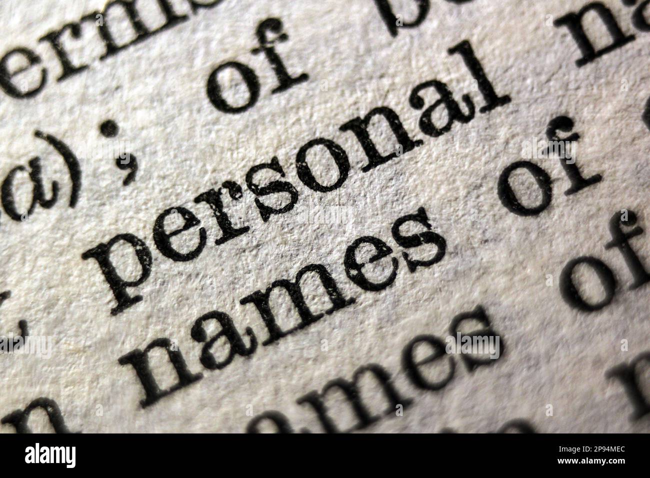Definition of words personal and names on dictionary page, closeup