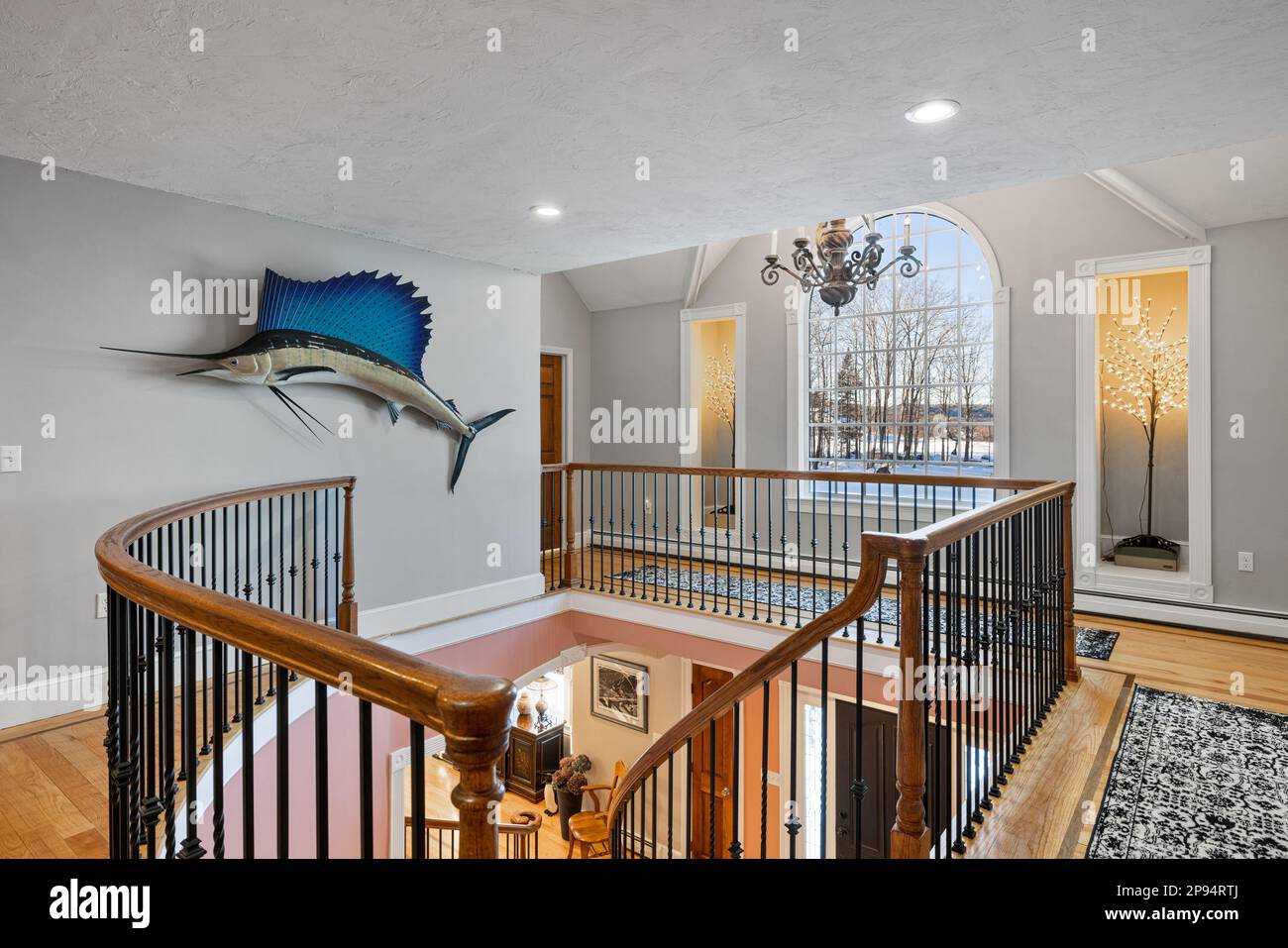 A large, decorative fish statue affixed to a wall in a vibrant, cozy