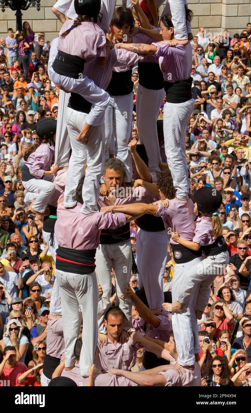 Minyons de Terrassa.'Castellers' building human tower, a Catalan tradition.Festa de la Merçe, city festival. Plaça de Sant Jaume.Barcelona, Spain Stock Photo