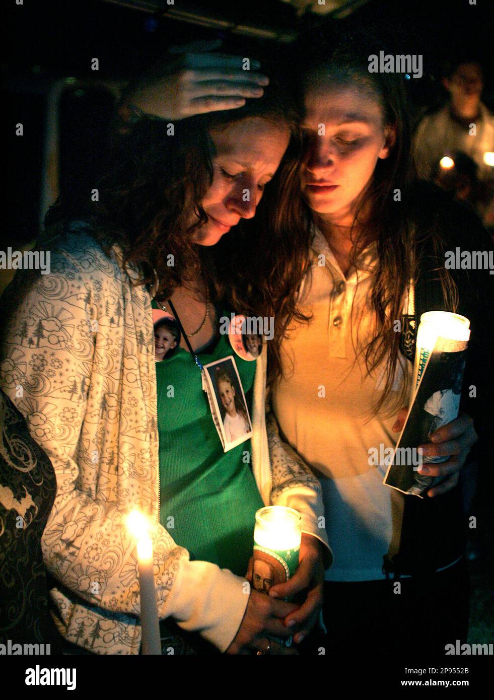 Amanda Lauramore comforts her cousin Crystal Sheffield who is the