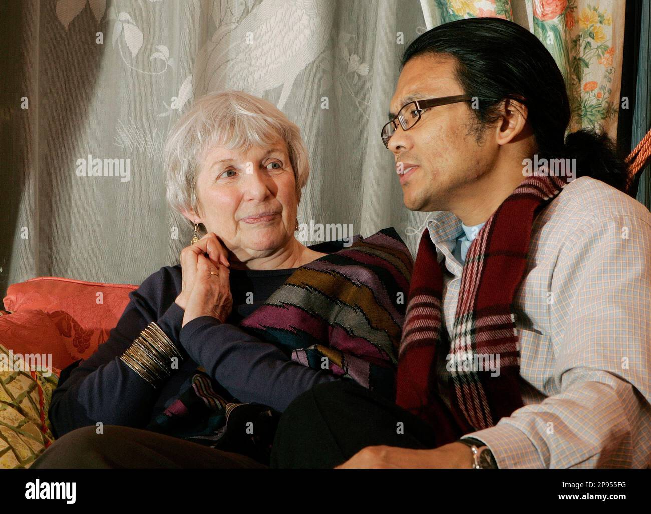 ADVANCE FOR FRIDAY, FEB. 13** Margaret Carne looks at husband Pradeep Thapa  as they sit together in their home in Jersey City, N.J., Sunday Jan. 11,  2009, talking about how they became