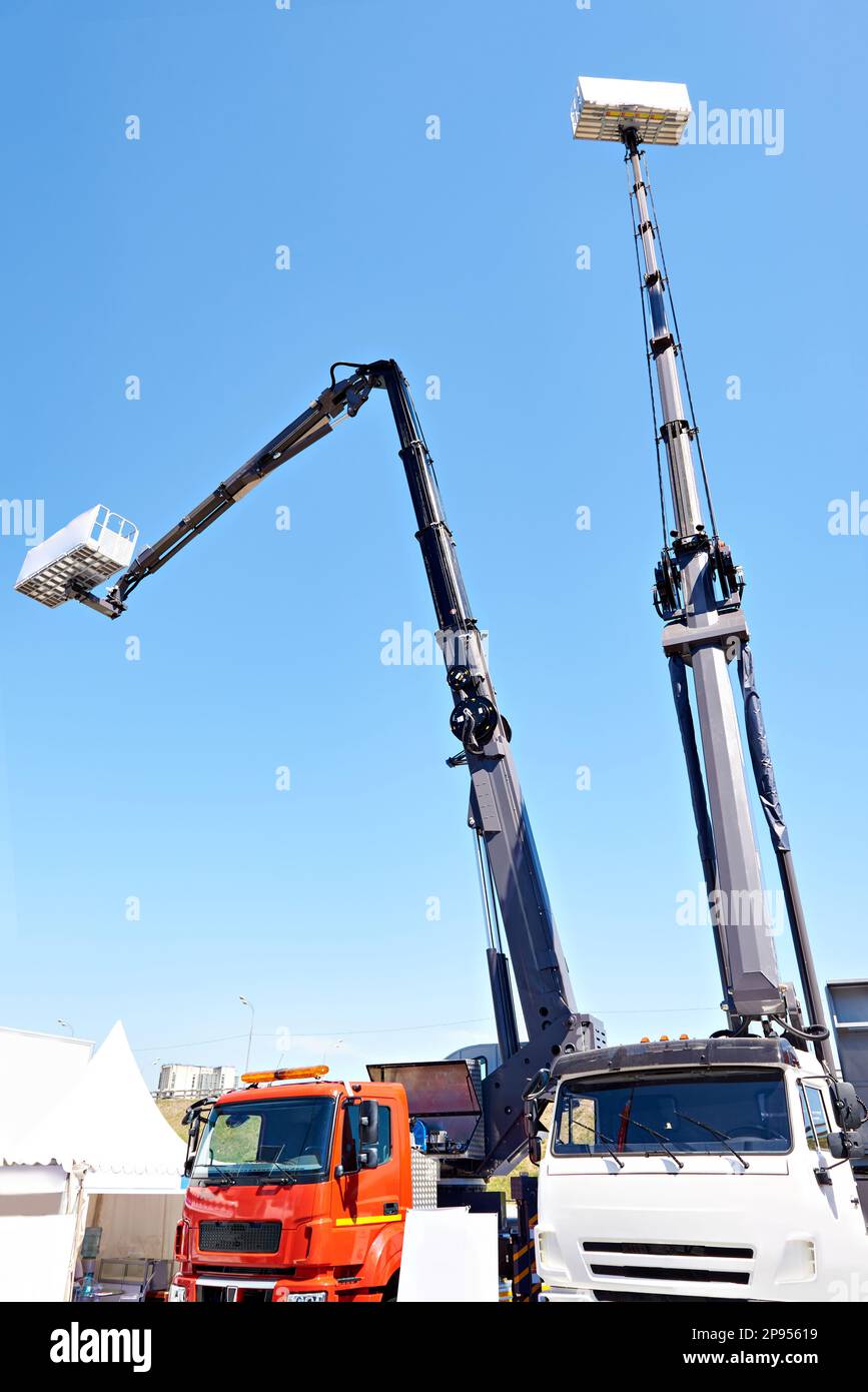 Truck mounted cranes with cradle Stock Photo Alamy