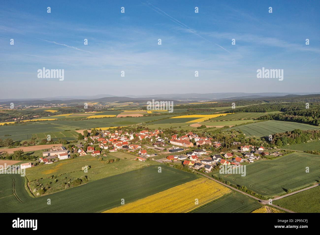 Germany, Thuringia, Grabfeld, Schwickershausen, village, rape fields, fields, landscape, sun, overview, aerial view, Stock Photo