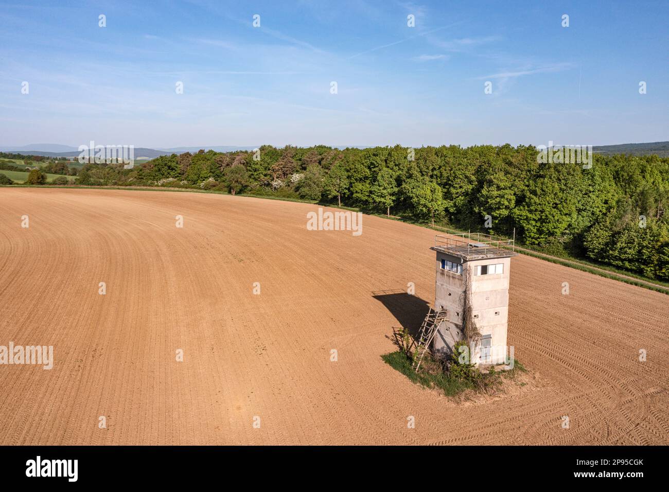 Germany, Thuringia, Grabfeld, Schwickershausen, former GDR border watchtower, fields, forest, landscape, sun, overview Stock Photo