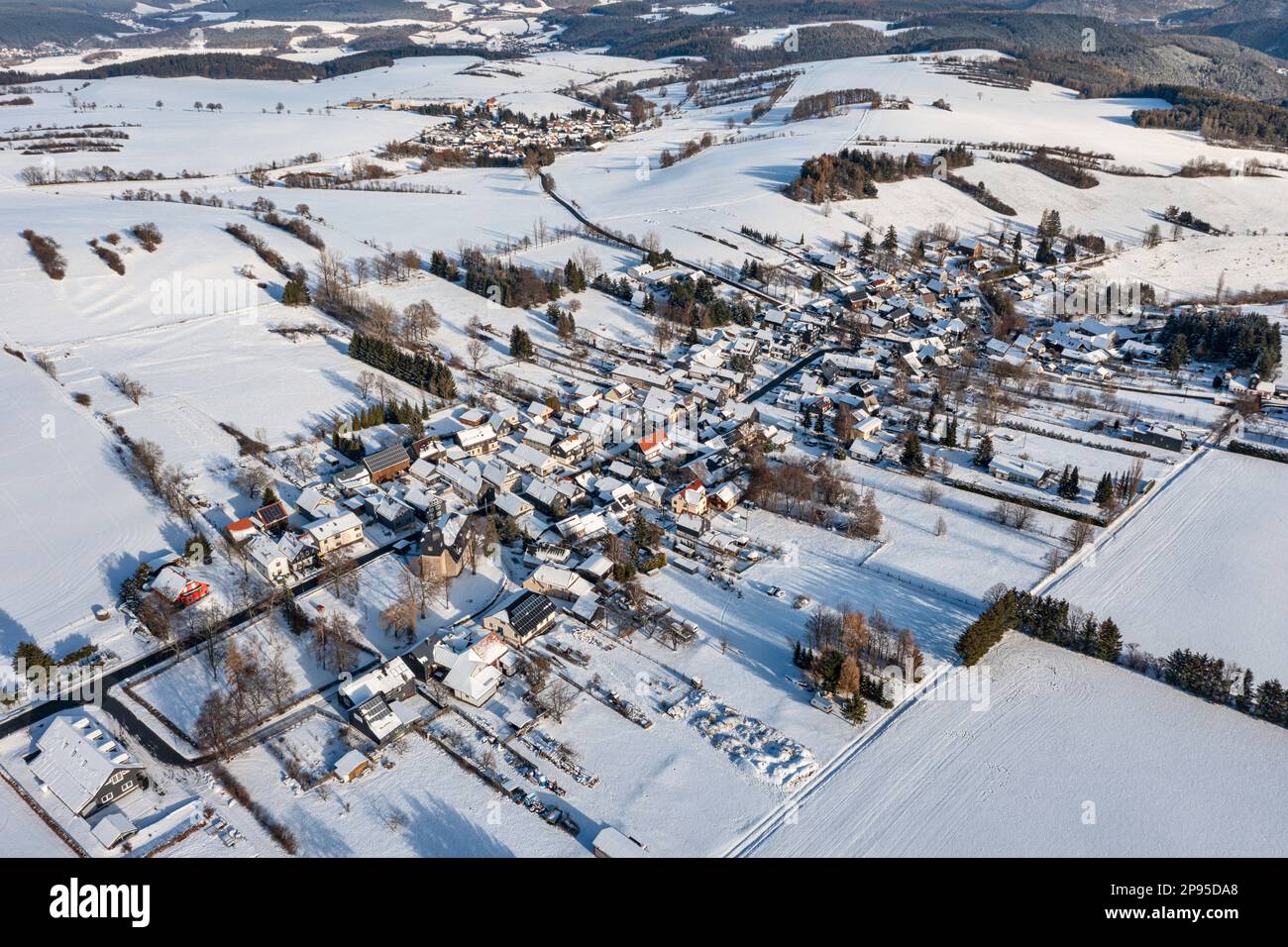 Germany, Thuringia, Koenigsee, Oberhain, village, fields, landscape, snow, Unterhain (background), Schwarzatal (background), overview, oblique view, aerial view Stock Photo