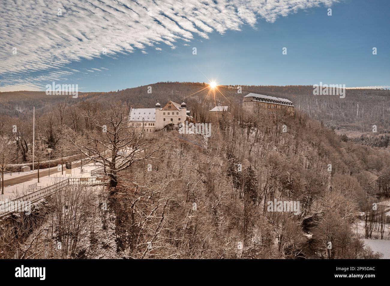 Germany, Thuringia, Schwarzburg, baroque castle, armory, sunrise, forest, river, snow, back light Stock Photo