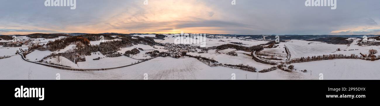 Germany, Thuringia, Allendorf, village, snow covered fields, forests, landscape, evening light, overview, aerial photo, partly back light, 36ö° panorama Stock Photo