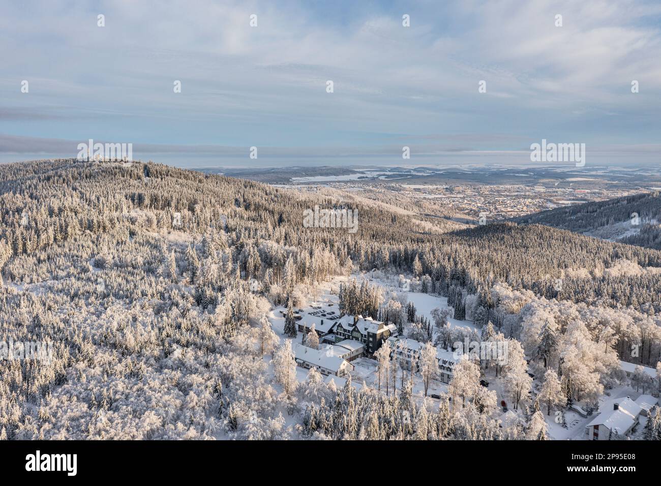 Germany, Thuringia, Ilmenau (background), hotel, Gabelbach, mountain Kickelhahn, forest, icy trees, snow, aerial photo Stock Photo