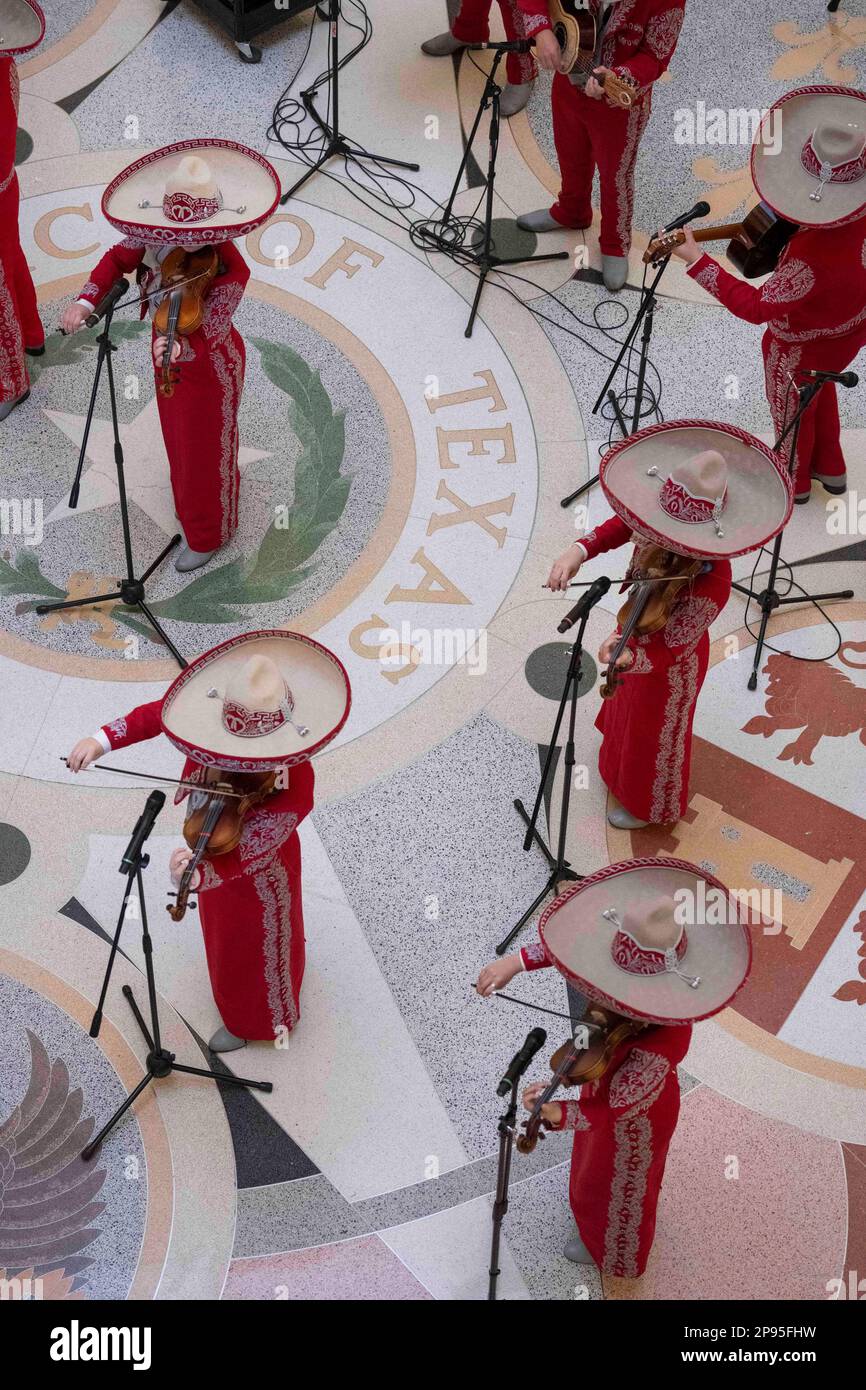 A high school mariachi from Starr County, Texas performs a noontime concert in the Texas Capitol Rotunda on March 7, 2023.  Mariachi is a type of traditional Mexican folk music, typically performed by a small group of strolling musicians dressed in native costume, and is especially popular  in south Texas, where high school groups often perform in competitions. ©Bob Daemmrich Stock Photo